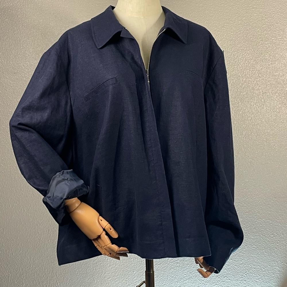 Navy blue linen jacket with zip front, collar and pockets.